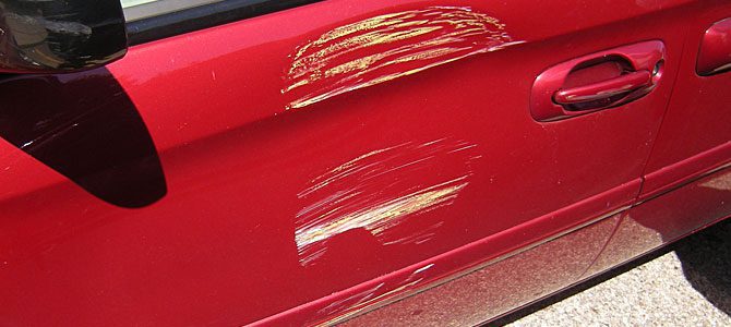 how to get scratched paint off a car